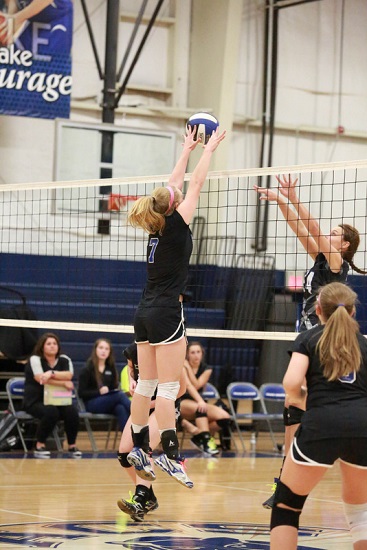 ACS blocks shot during volleyball game