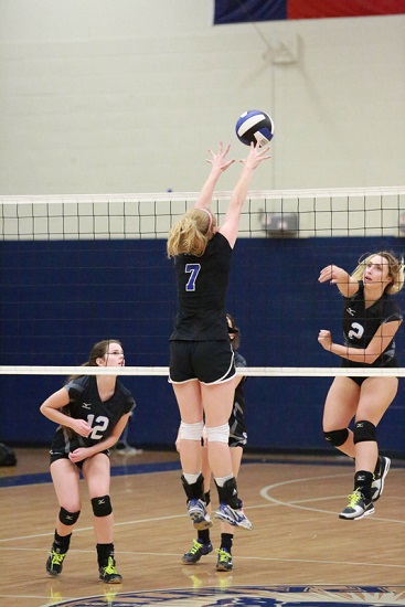 Another block during ACS volleyball game