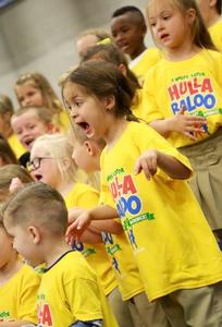 Students singing for their grandparents