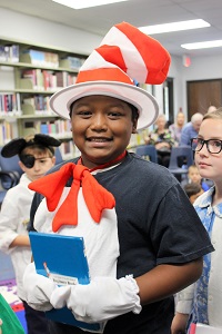Boy with Dr Suess costume and book