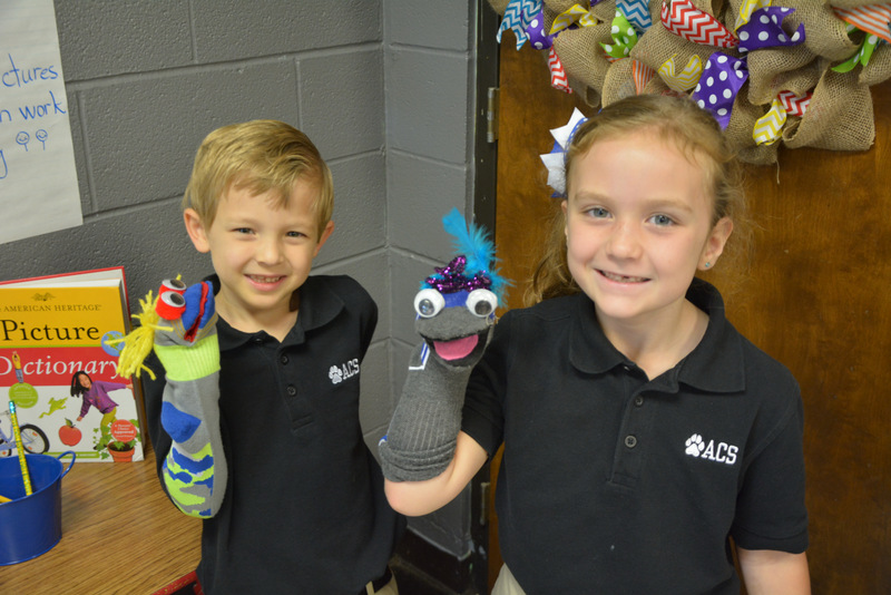Students with puppets
